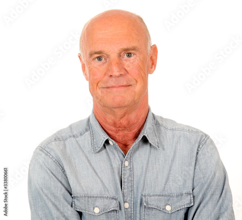 Portrait of smiling senior man with blue shirt © goodluz