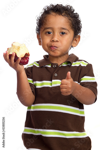 Toddler Eating Apple and Giving Thumb Up