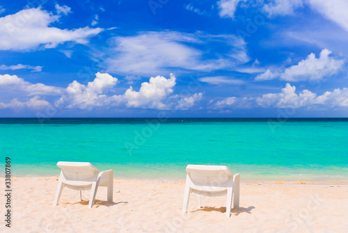 Chairs on tropical beach © Nikolai Sorokin