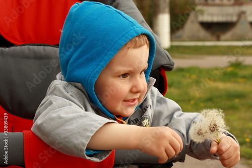 A boy in a wheelchair.