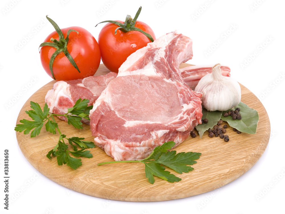 raw beef meat on cutting board.  Isolated over white background