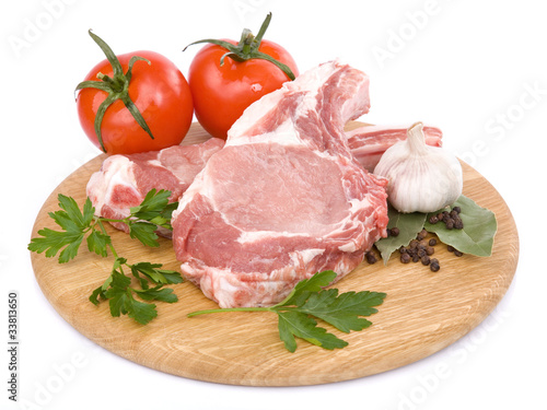 raw beef meat on cutting board. Isolated over white background
