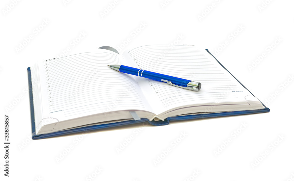 planner and blue pen on a white background planner and blue pen on a white background