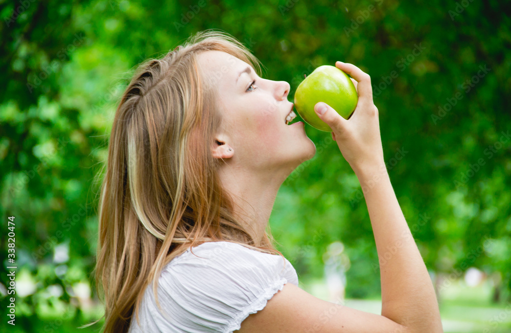 beautiful girl with the apples on the grass beautiful girl with the apples on the grass
