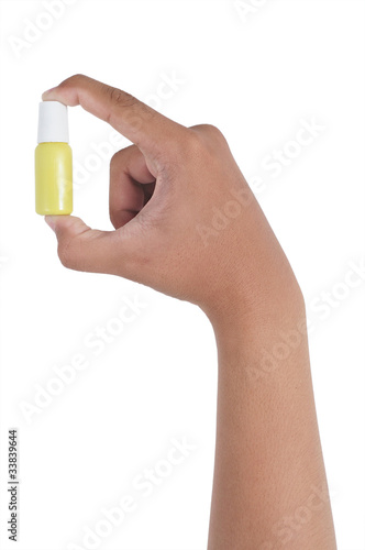 Small medicine bottle in hand