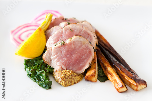 Sliced pork with spinach and parsnips