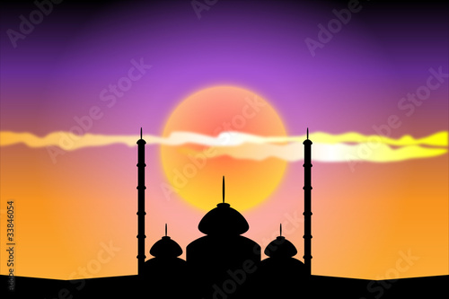 Silhouette of mosques at sunset