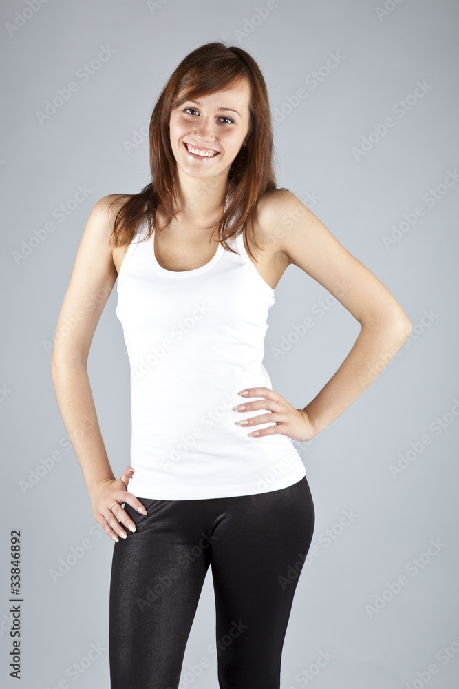 The young long-haired girl in a white vest The young long-haired girl in a white vest