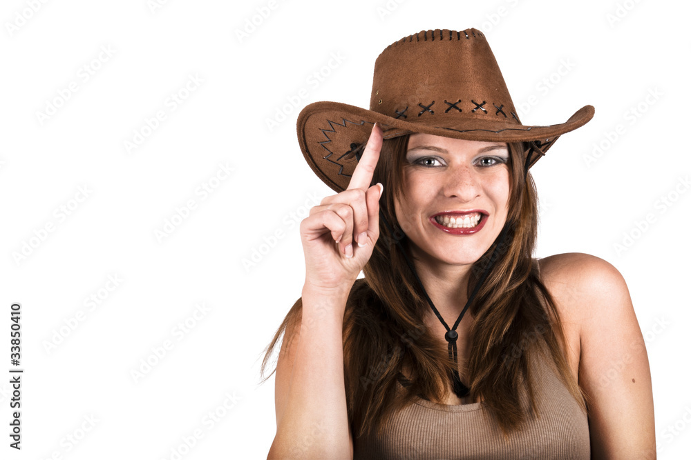 Sexy cowgirl smiling and tapping her hat Sexy cowgirl smiling and tapping her hat
