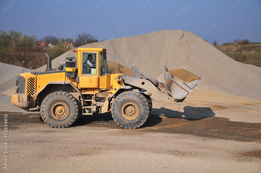 excavator at the construction site excavator at the construction site