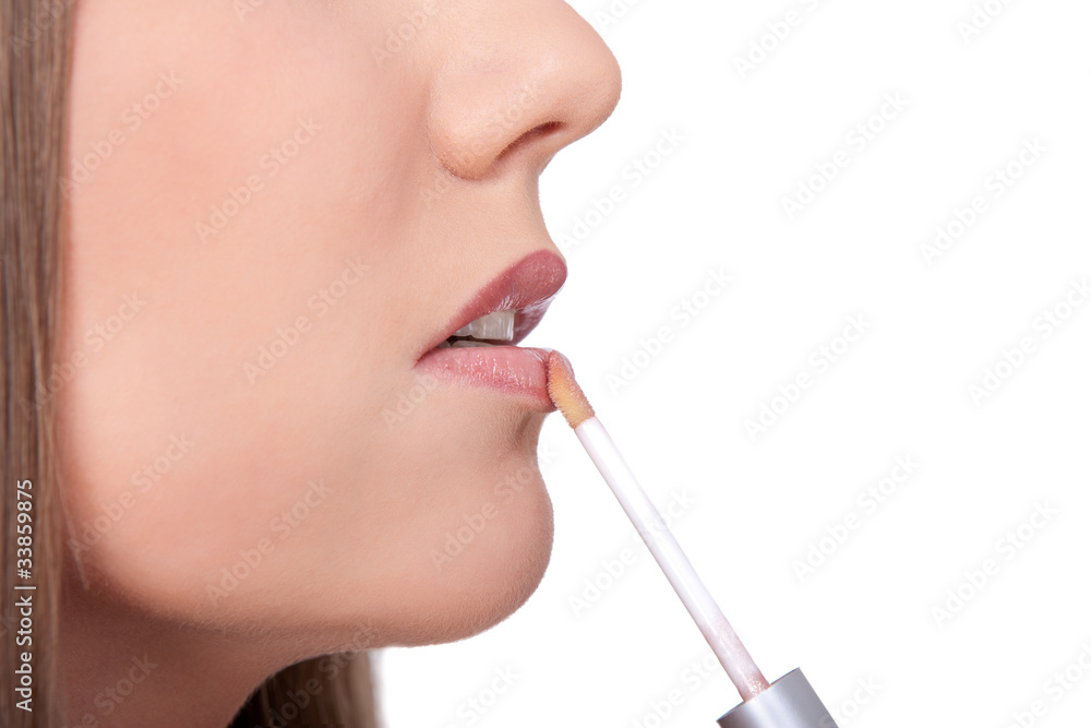 applying lip gloss applying lip gloss