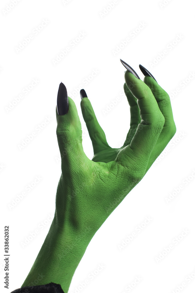 Obraz premium Witch's green hand, white background.