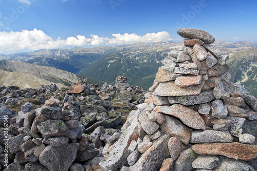 stone pyramid on top of mountain peak © rookie72