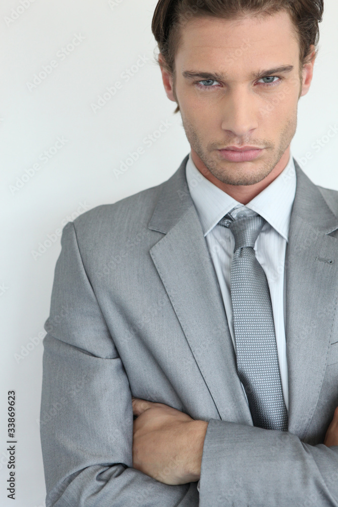 Young businessman with arms crossed Young businessman with arms crossed