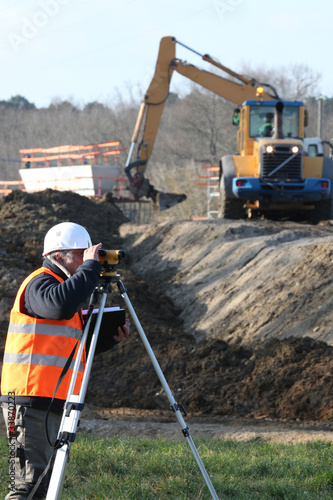 A land surveyor using an altometer photo