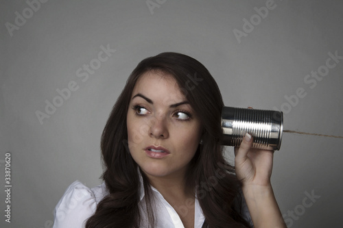 woman on tin can string phone