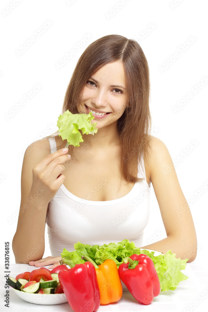Young woman eating healthy salad on white Young woman eating healthy salad on white