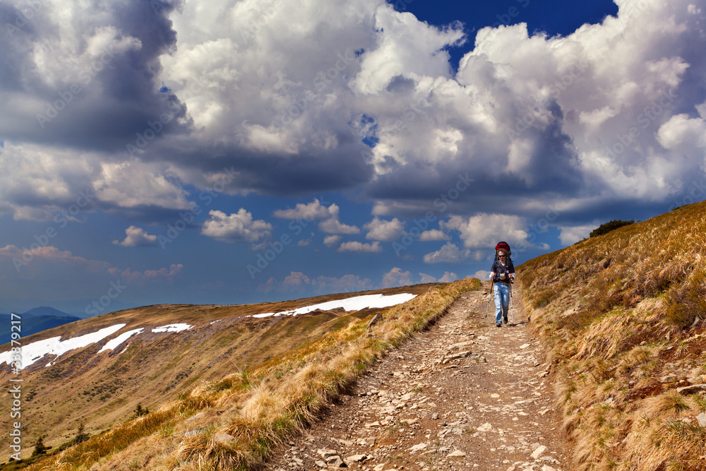 sportive man on the mountain trek