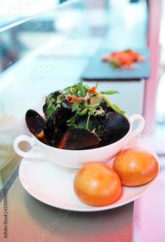 Plate of mussels on takeuot restaurant counter