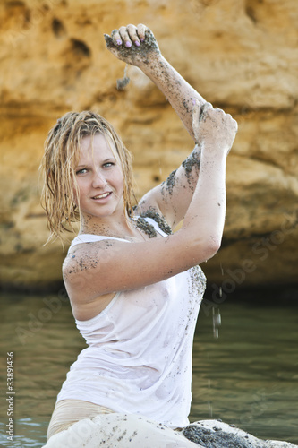 redheaded girl in a wet white T-shirt