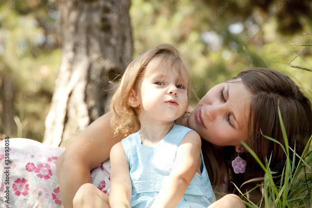 Little girl and mother in the park Little girl and mother in the park