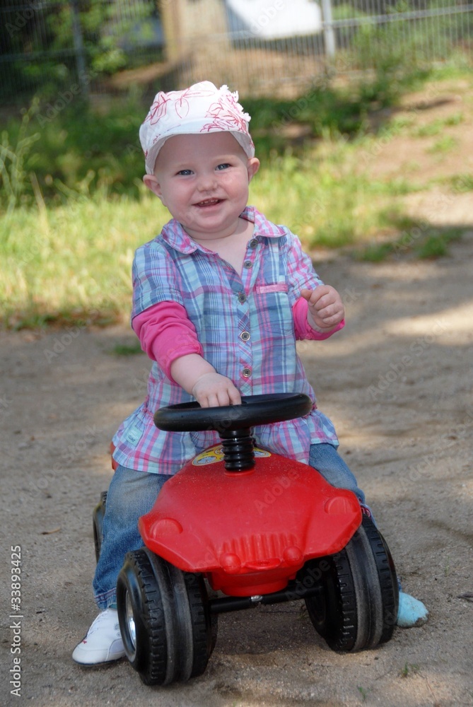 Child on a bobby car Child on a bobby car