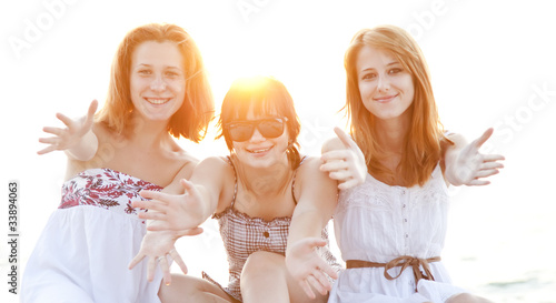 Portrait of three beautiful girls at the beach.