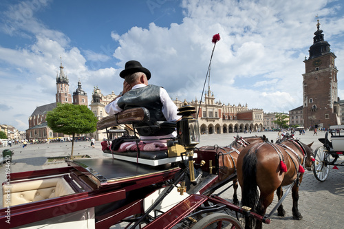 Cabby man on the Old Town square in Krakow, Poland photo