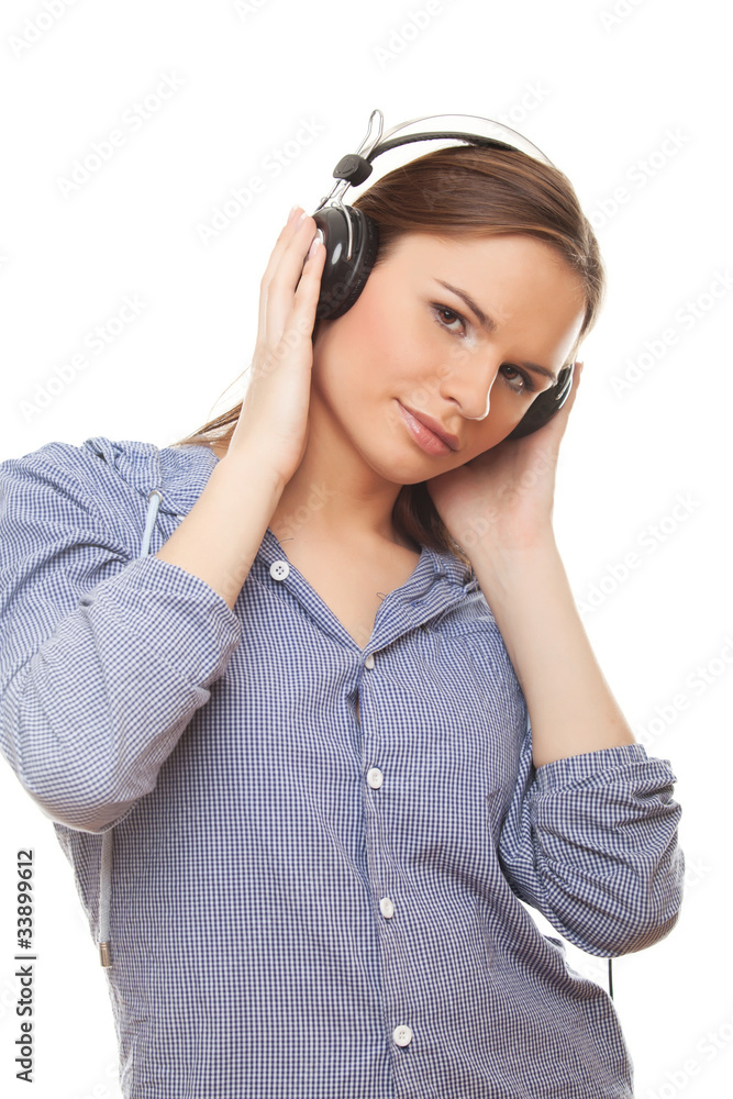 Young woman enjoying music in headphones Young woman enjoying music in headphones