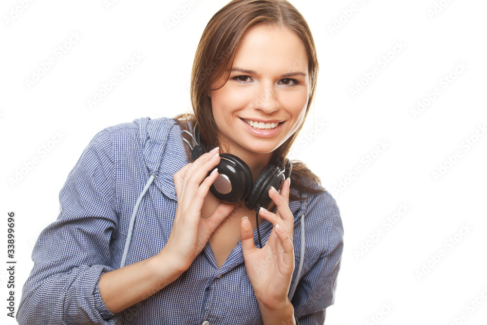 Joyful young woman wiht headphones on her neck Joyful young woman wiht headphones on her neck