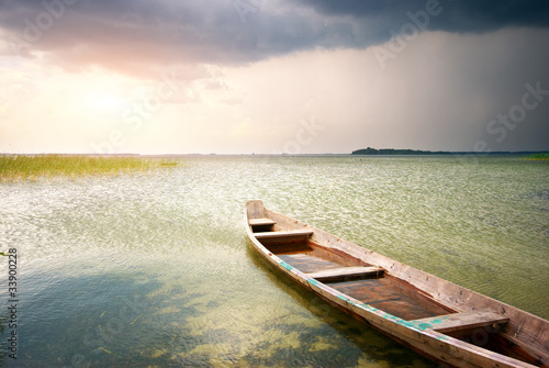Lonely boat on lake © GIS