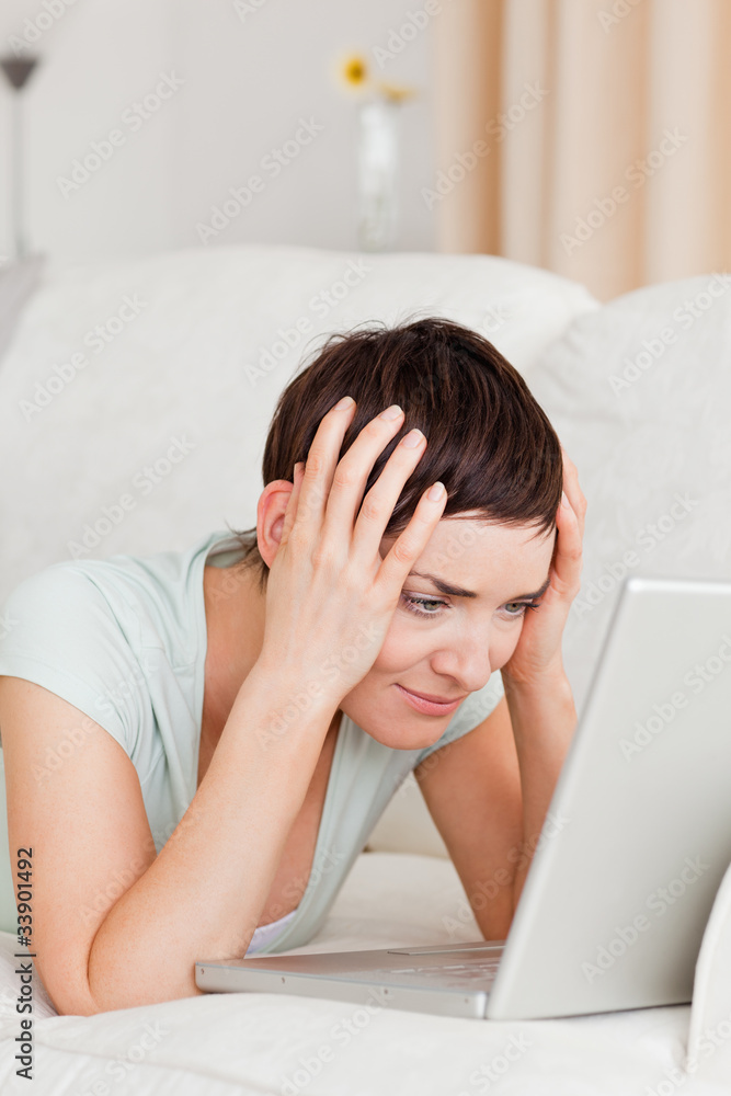 Portrait of an unhappy woman using a laptop Portrait of an unhappy woman using a laptop