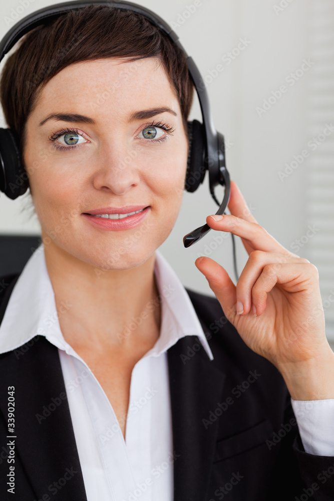 Portrait of a smiling secretary with a headset Portrait of a smiling secretary with a headset
