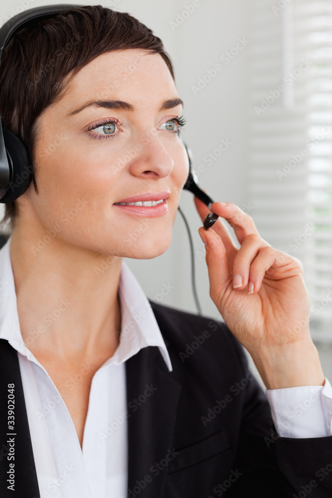 Portrait of a serious secretary with a headset Portrait of a serious secretary with a headset