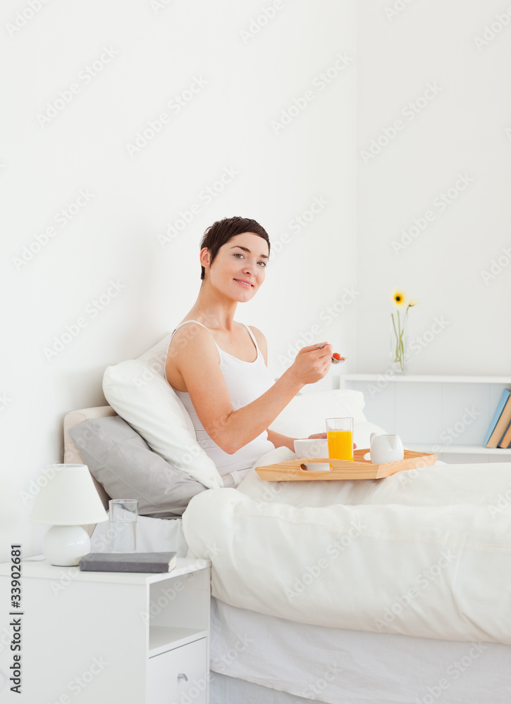 Portrait of a woman eating breakfast