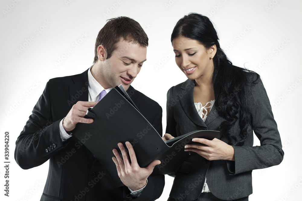 businessman and businesswoman looking at portfolio businessman and businesswoman looking at portfolio