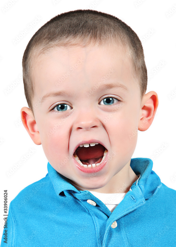 Cute little boy posing for camera on white background Cute little boy posing for camera on white background