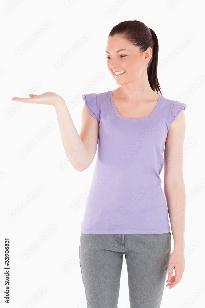Charming woman showing a copy space Charming woman showing a copy space