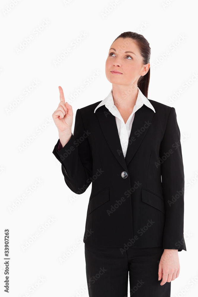 Beautiful woman in suit pointing at a copy space Beautiful woman in suit pointing at a copy space
