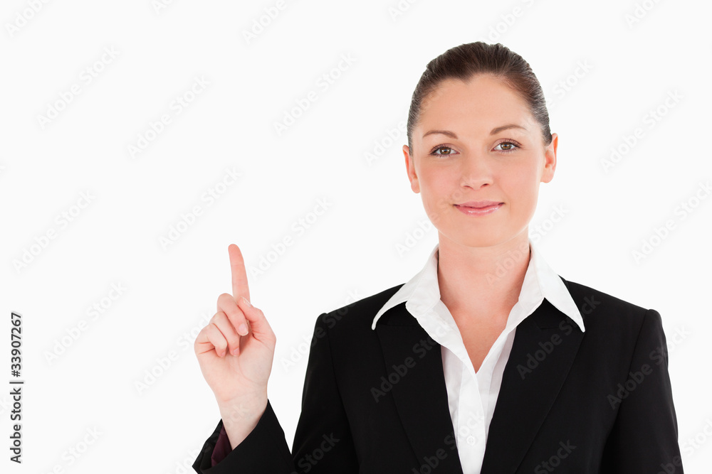 Good looking woman in suit pointing at a copy space Good looking woman in suit pointing at a copy space