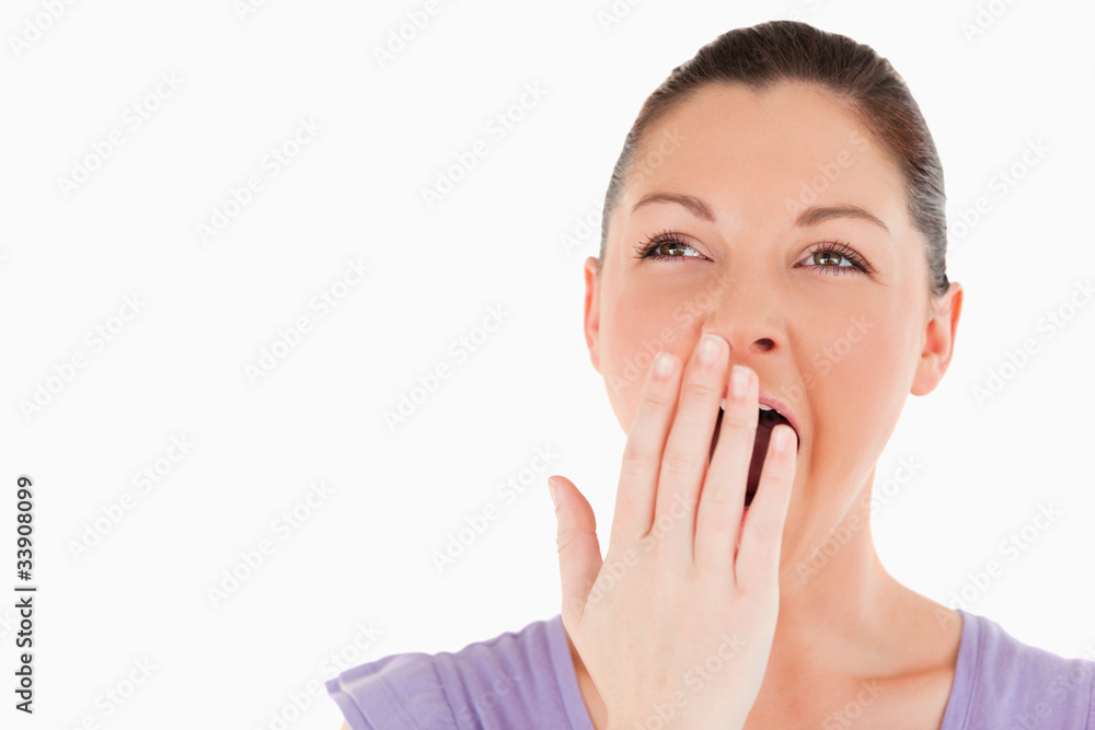 Portrait of a beautiful woman yawning while standing Portrait of a beautiful woman yawning while standing
