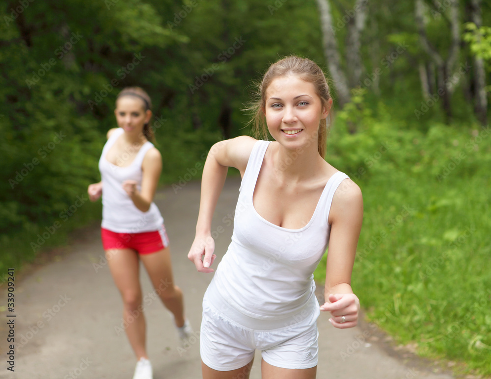 Fototapeta premium Young woman doing sport outdoors