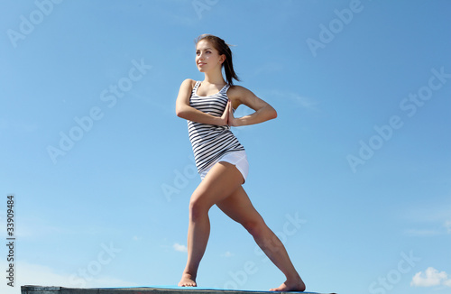 Portrait of a young woman doing exercises