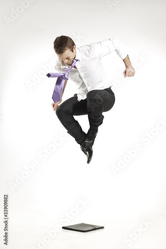 angry businessman jumping and stomping on portfolio