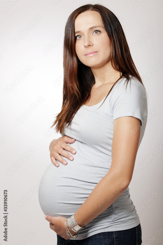 Beautiful pregnant woman with long dark hair. Beautiful pregnant woman with long dark hair.