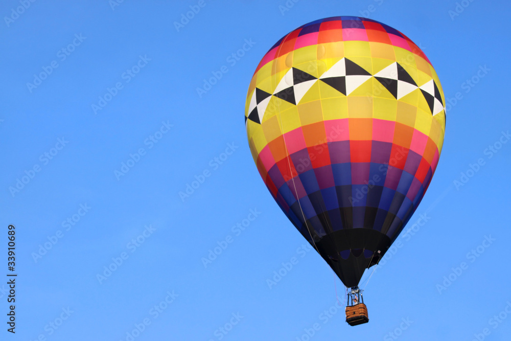 Fototapeta premium Hot air balloon against blue sky background