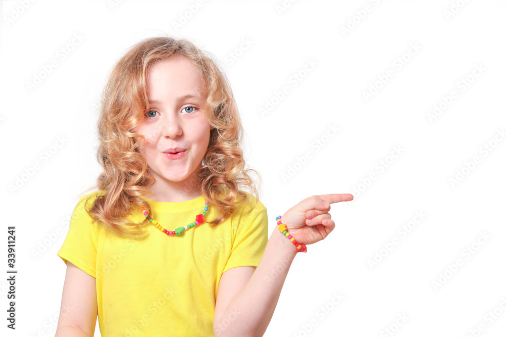 Girl child pointing to blank copy space (your product) Girl child pointing to blank copy space (your product)