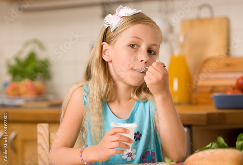 girl eating yoghurt