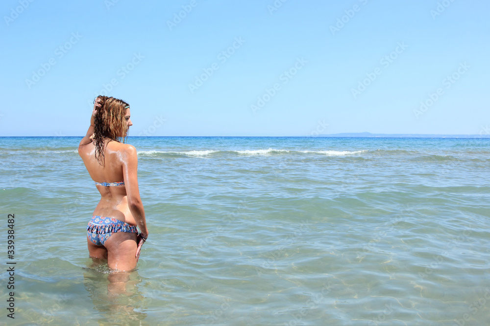 a beautiful woman relaxing on the beach a beautiful woman relaxing on the beach