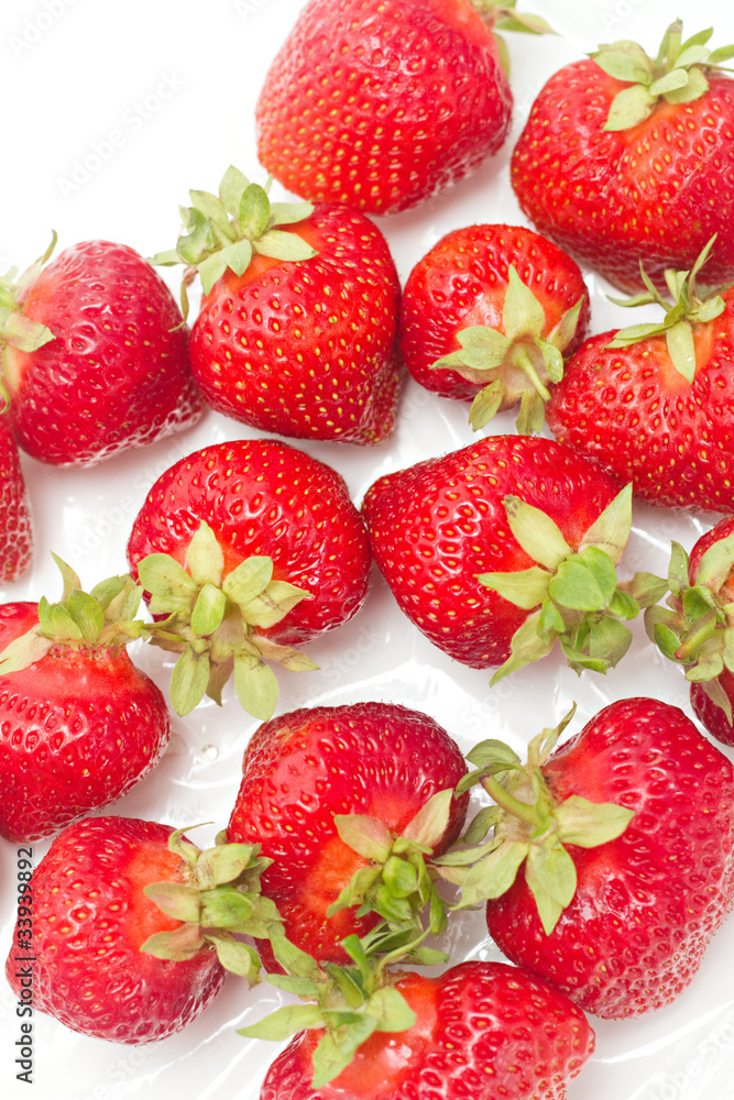 lots of fresh strawberries against white background lots of fresh strawberries against white background